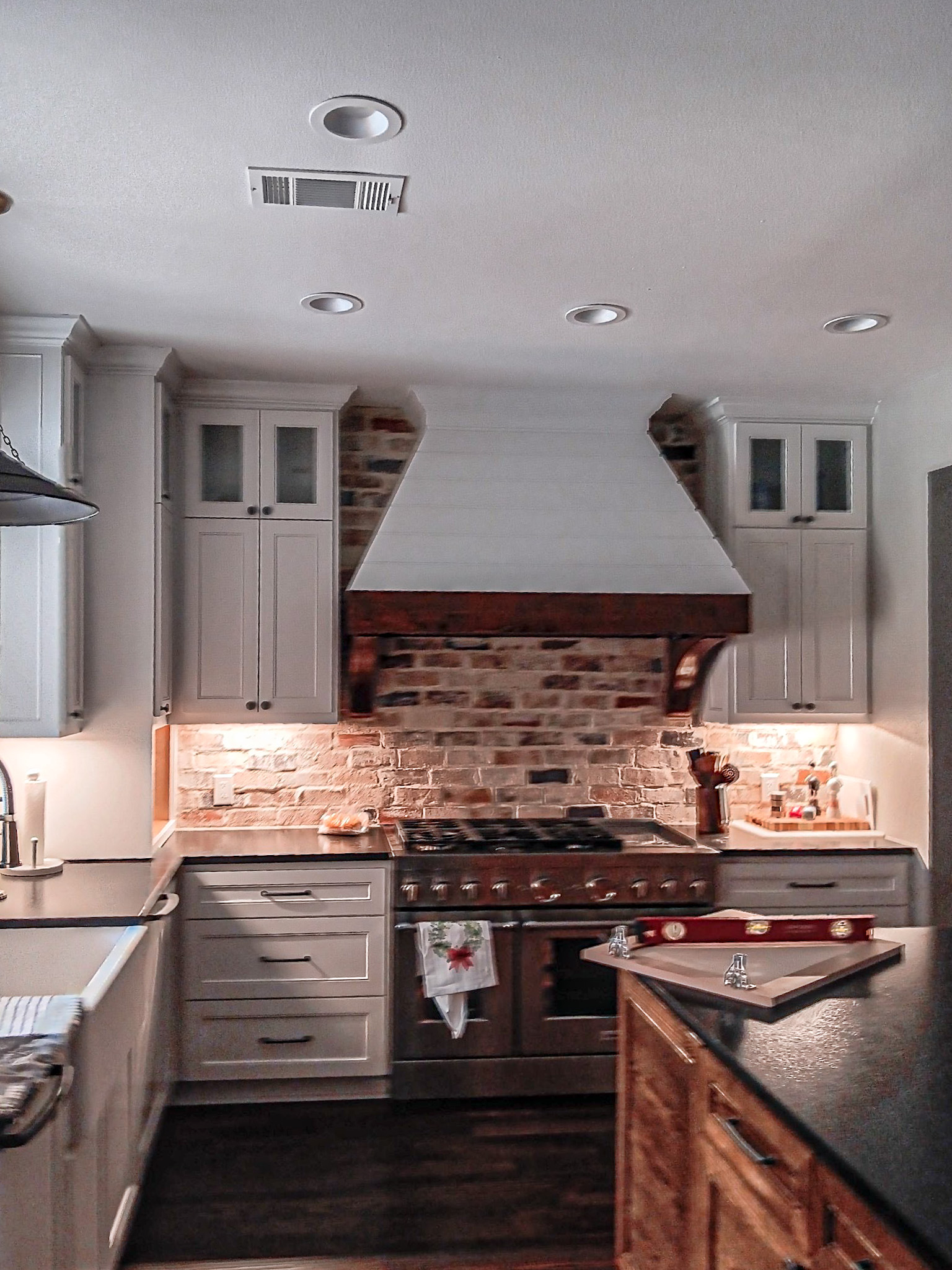 Kitchen remodel — white cabinets, brick backsplash